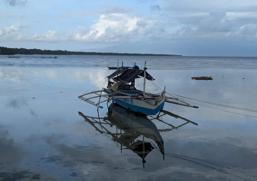 Outrigger on Still Water
